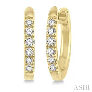 1/8 ctw Round Cut Diamond Huggie Earrings in 10K Yellow Gold