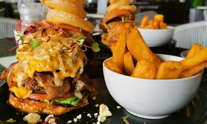 200g Gourmet Burgers with Rustic Fries and Onion Rings at The Hyde Hotel